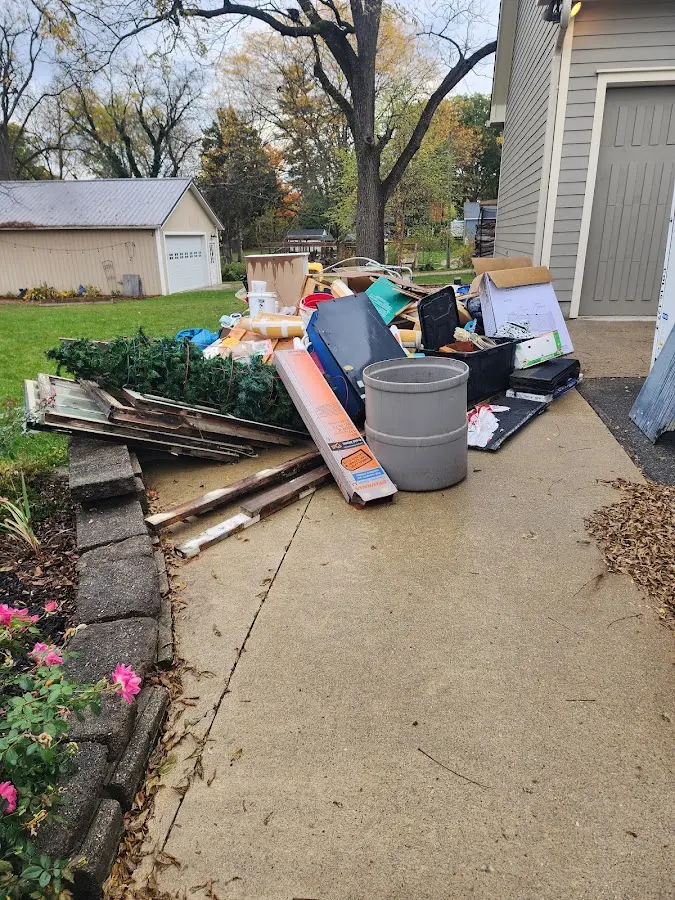 Dumpster being loaded with debris for Commercial Dumpster Rental in Ocean Shores